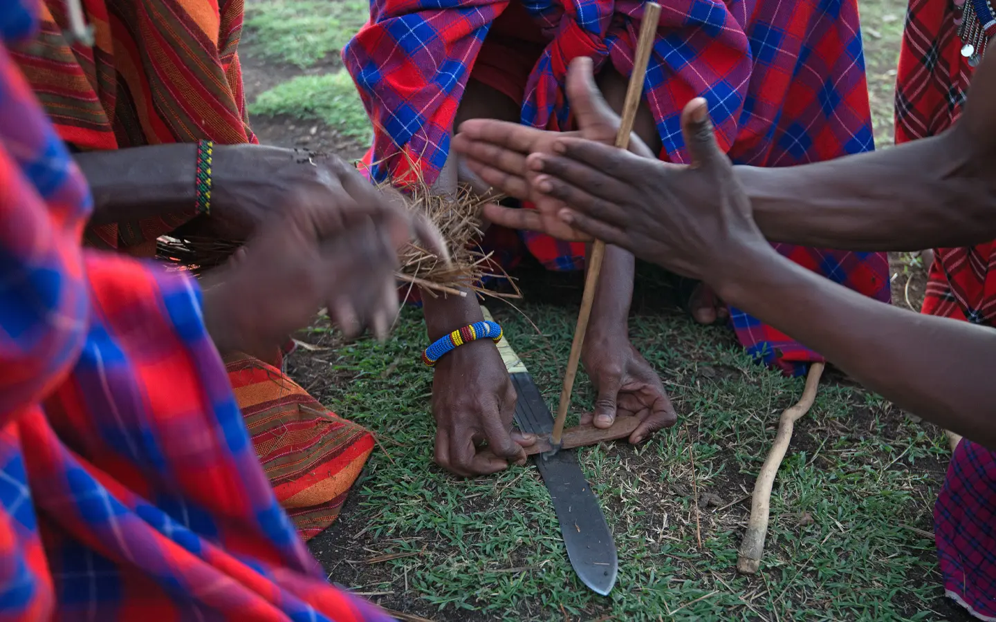 Maasai Mara - Maasai people make a fire - African Adventure Specialists - Best Destination Management Company in Kenya